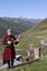 Georgian man plays local musical instrument of panduri and sings traditional svanetian songs in Ushguli, Caucasus Mountains, Georg