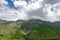 Georgian mountains and ridges beautiful natural landscape with clouds, paths and rivers