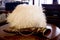 Georgian sheepskin cap made of white sheep`s wool, brown horn `k