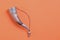 Georgian traditional horn for wine drinking. Curved horn isolated on bright orange background. Copy space.