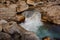 Georgous mountain river with a tiny waterfall among the rocks