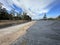 Geotextile fabric along canal in rural setting under cloudy sky