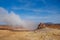 Geothermal area Namafjall Hverir, Iceland. The area around the boiling mud is multicolored and cracked. Place for text or