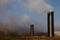 Geothermal Pipes in Grassy Landscape with Blue Sky