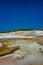 Geothermal pools at Porcelain Basin boardwalk trail inside Norris Geyser Basin