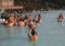 Geothermal spa visitors with silica mud masks relax and refresh at the famous Blue Lagoon