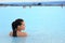 Geothermal spa - woman relaxing in hot spring pool