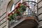 Geranium on old ornate balcony