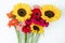 Gerbera and sunflower flowers on white background