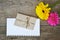 Gerberas floewrs with letter and white paper for your text on wood