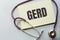 GERD written on a clipboard, Medical concept