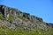 The Gerduberg  basalt cliffs on the green hillside in Iceland