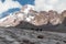 Gergeti Glacier - A heard of horses crossing the Gergeti Glacier, under snow-capped Mount Kazbeg in Caucasus,