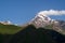 Gergeti trinity church or Tsminda Sameba with background of mountains landscape, Stepantsminda, Kazbegi city, Georgia