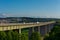 German Autobahn bridge for the highway A3 over the danube river near Regensburg with moving cars in golden afternoon light on