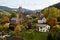 German bertrada castle in the Eifel with shining autumn leaves