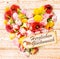 German birthday wishes on a colourful floral heart