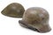 German and British World War Two military helmets, battle of Normandy 1944