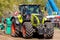 German claas axion tractor drives on track by a traktor pulling event