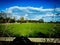 German colorful farm with horses and nice cloud blue sky