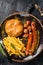 German currywurst sausage, curry wurst served with French fries. Dark background. Top view