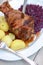 German Eisbein with braised cabbage(Sauerkraut),salad and beer,roasted pork knuckle.call Schweinshaxe,Haxe,Bavarian