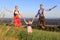 German Family in Bavarian dress jumping happy