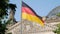 German Flag In Front of The Reichstag in Berlin, Germany Fluttering In The Wind