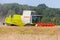 German havester Claas Lexion 650 works on a corn field