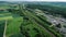 German highway, rest area and highspeed train railroad track - aerial view