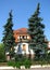 German House with big pine trees in front