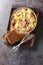 German Jager Kohl, hunter\\\'s cabbage with Sausage, Bacon and Potatoes close-up in a bowl. Vertical top view