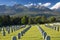 German military cemetery in autumn with mountains in the background and many graves of soldiers killed in the Second World War.