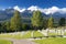 German military cemetery in autumn with mountains in the background and many graves of soldiers killed in the Second World War.