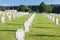 German military cemetery in autumn with mountains in the background and many graves of soldiers killed in the Second World War.