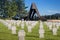 German military cemetery in autumn with mountains in the background and many graves of soldiers killed in the Second World War.