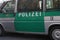 German police green van with security grills