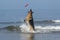 German Shepherd, Male catching frisbee, beach in Normandy