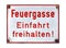 German sign isolated over white. Fire lane, keep entrance clear