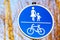 German sign Sidewalk with bike path. blue background with pedestrian and bicycle
