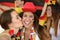 German soccer sport fans kissing celebrating.