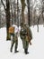 German soldiers of World War II in a snowy forest, view from the back