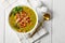 German split pea soup with bacon on a white plate