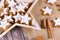 German star shaped glazed Christmas cinnamon cookies called `Zimtsterne` made with amonds, egg white, sugar, cinnamon and flour