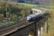 A German train speeding over a historical viaduct