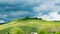 German vineyard in spring with rain clouds, dark sky, sunlit on vineyard, Germany