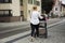 German women push stroller on street near tramway station at Sandhausen