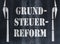 German word Grundsteuerreform property or land tax reform written on asphalt