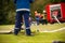 Germany, Baden Wurttemberg, Niederstetten. September 2019. Young firefighters in training, pumping water