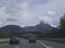 GERMANY, Bavaria, May 5, 2019: View of driver car window looking at cars on German Highway with view on mountain snow